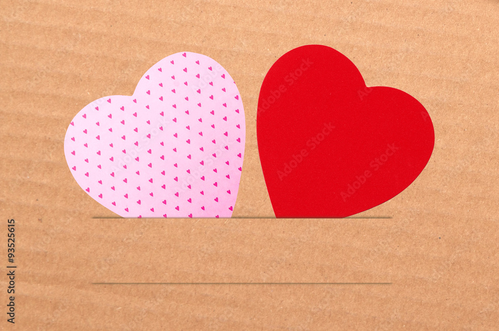 Paper hearts on brown background, close up