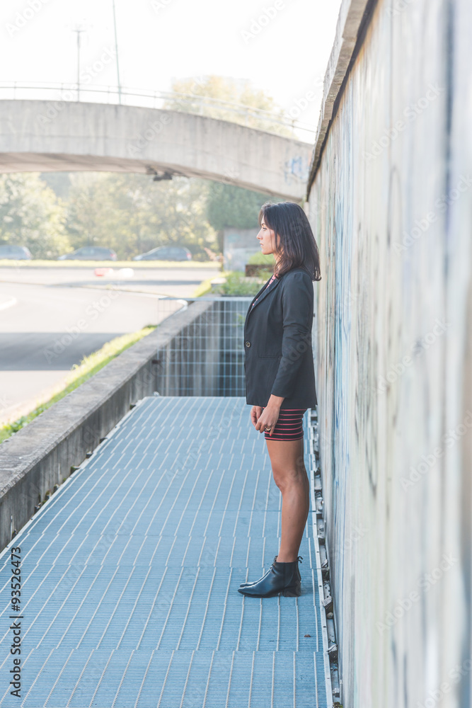 Beautiful girl posing in an urban context Beautiful girl posing in an urban context