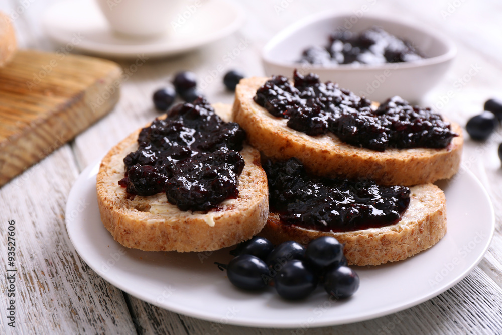 Fresh toast with butter and jam on table close up Fresh toast with butter and jam on table close up