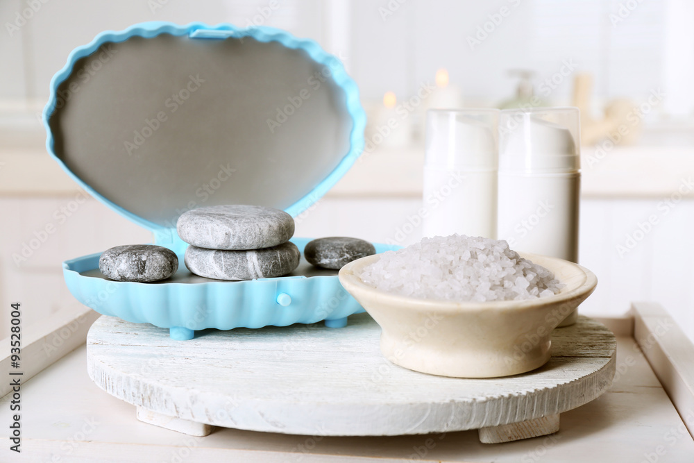 Spa stones and spa treatments on light background