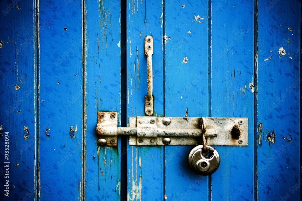 Blue wooden door with padlock