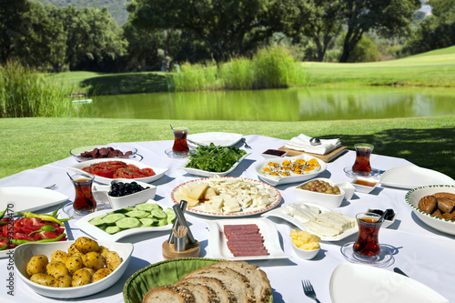 Rich and delicious Turkish breakfast on rounded table