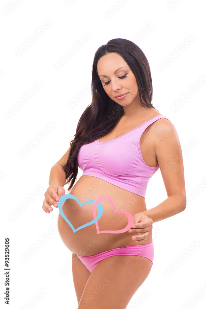 Beautiful future mother waiting baby. Boy, girl twins. Blue and pink hearts at the pregnant belly. Beautiful future mother waiting baby. Boy, girl twins. Blue and pink hearts at the pregnant belly.