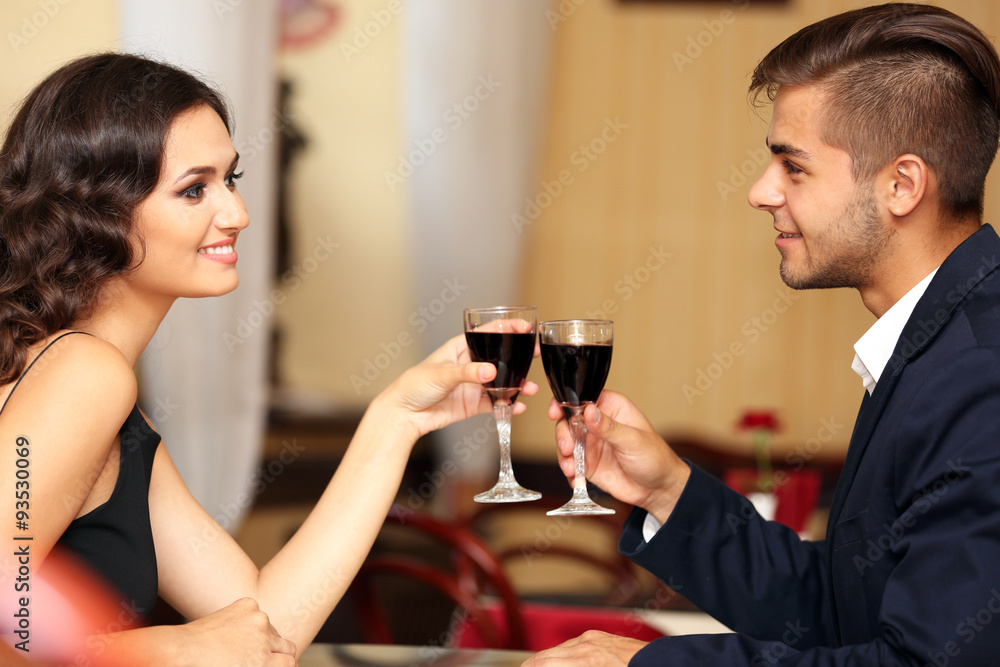 couple in love cheers at the restaurant couple in love cheers at the restaurant