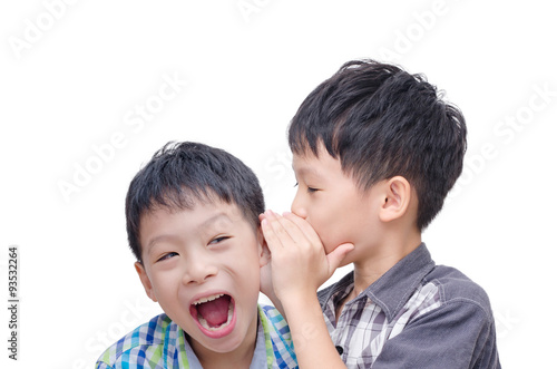 Tableau sur toile Young Asian brother whispering his twin on white background