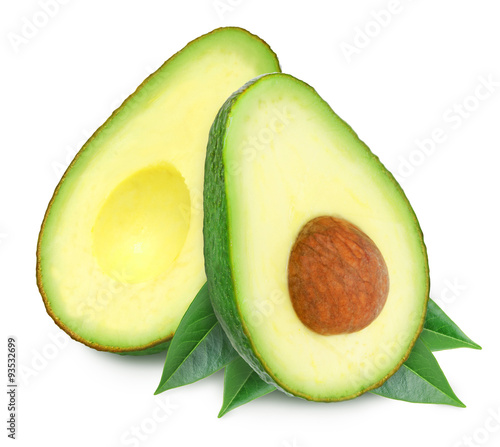 Two slices of avocado with leaves isolated on the white background. One slice with core. Design element for product label.