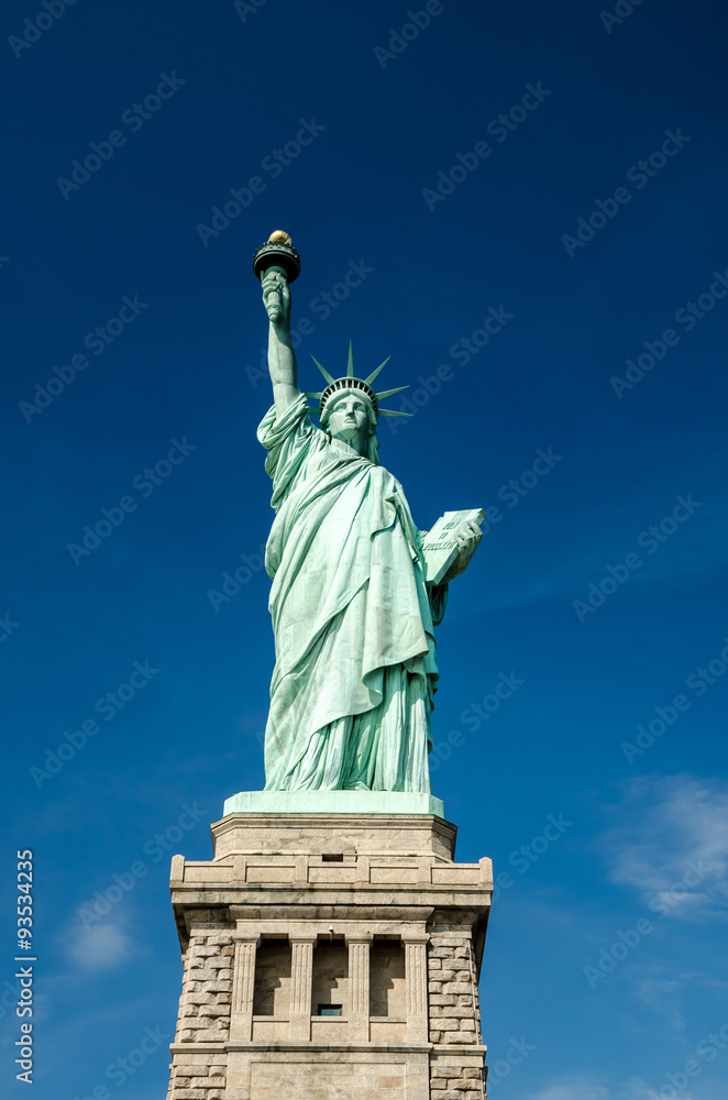 Fototapeta premium Statue of Liberty on blue clear sky, New York City, USA