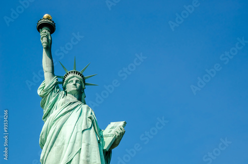 Statue of Liberty on blue clear sky, New York City, USA