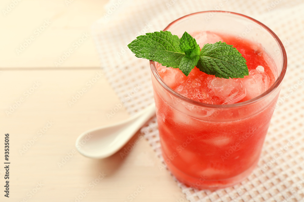 Cold watermelon drinks in glasses, on wooden table background Cold watermelon drinks in glasses, on wooden table background