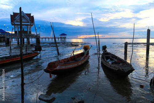 Small fishing boats moored on the waterfront. © nakhonthesis