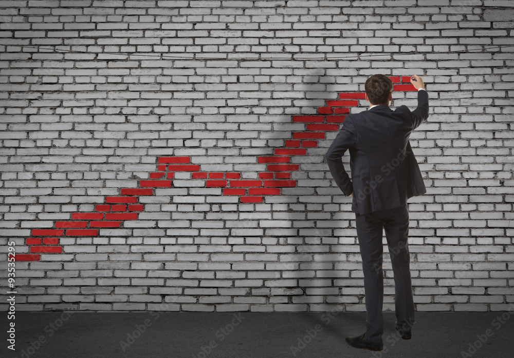 Businessman drawing increasing graph Businessman drawing increasing graph