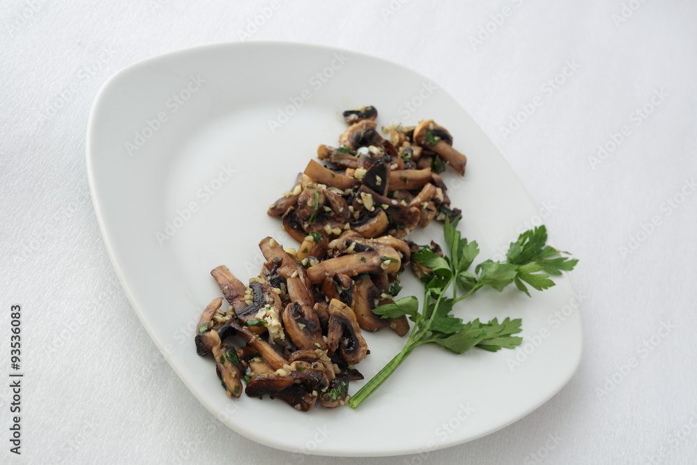 Mushroom dish cooked with a little parsley and orange. Mushroom dish cooked with a little parsley and orange.