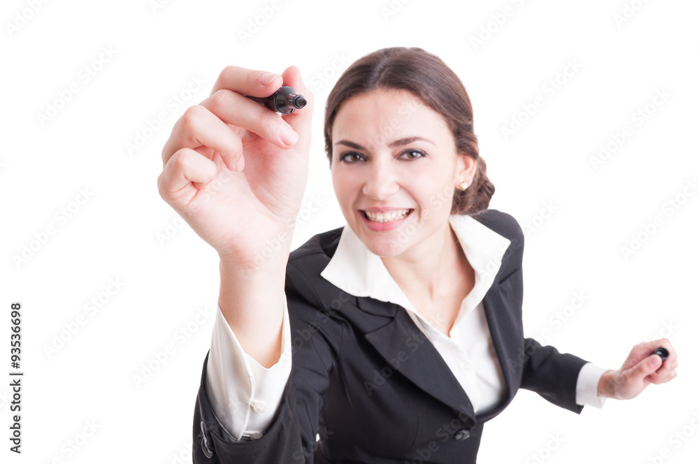 Smiling business woman writing with black marker on transparent Smiling business woman writing with black marker on transparent