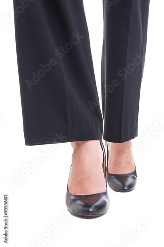 Close-up of business woman feet wearing black shoes walking
