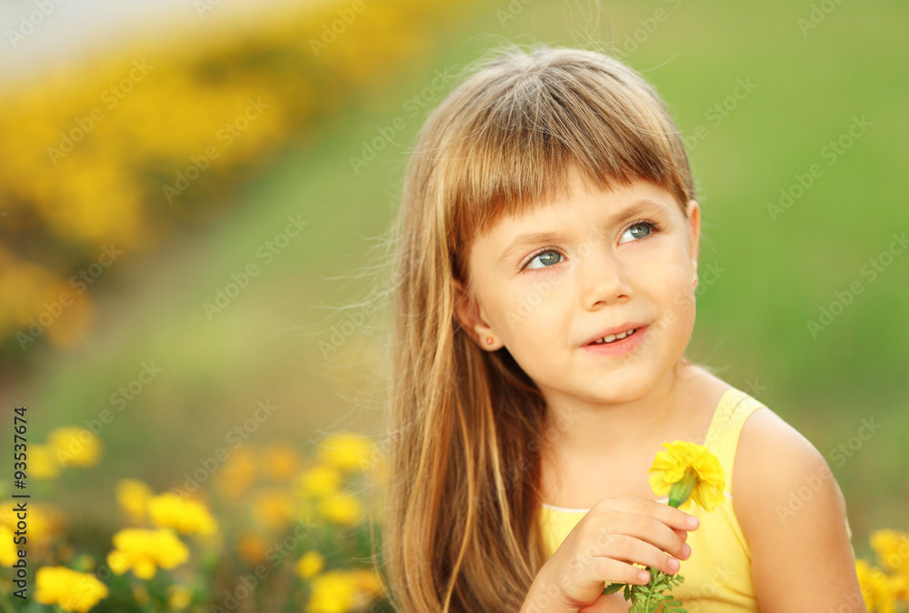 Little girl with flowers outside Little girl with flowers outside