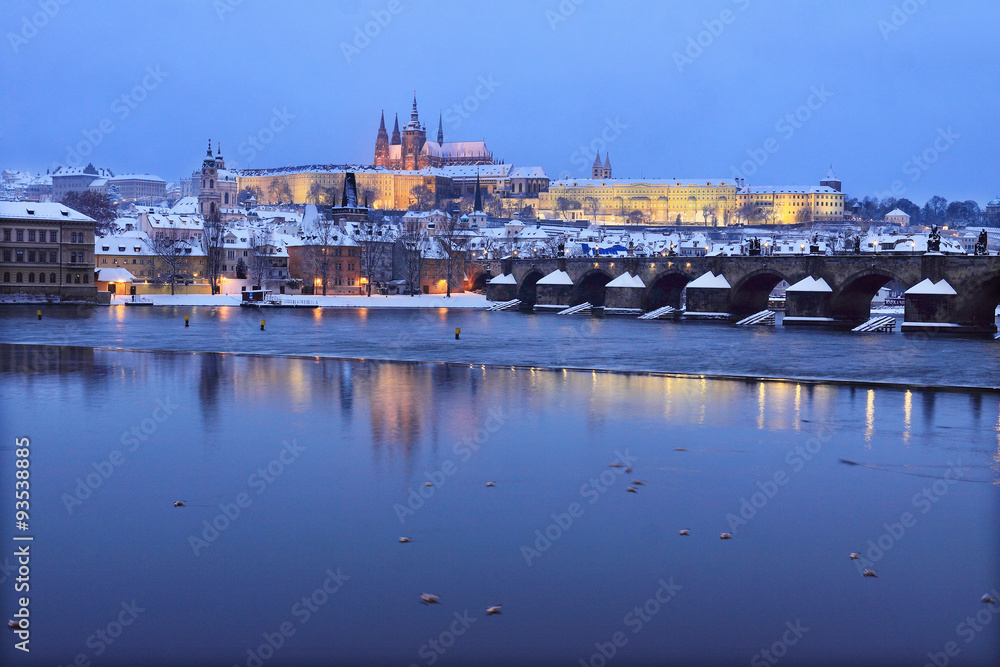Evening romantic colorful snowy Prague gothic Castle with Charles Bridge, Czech Republic