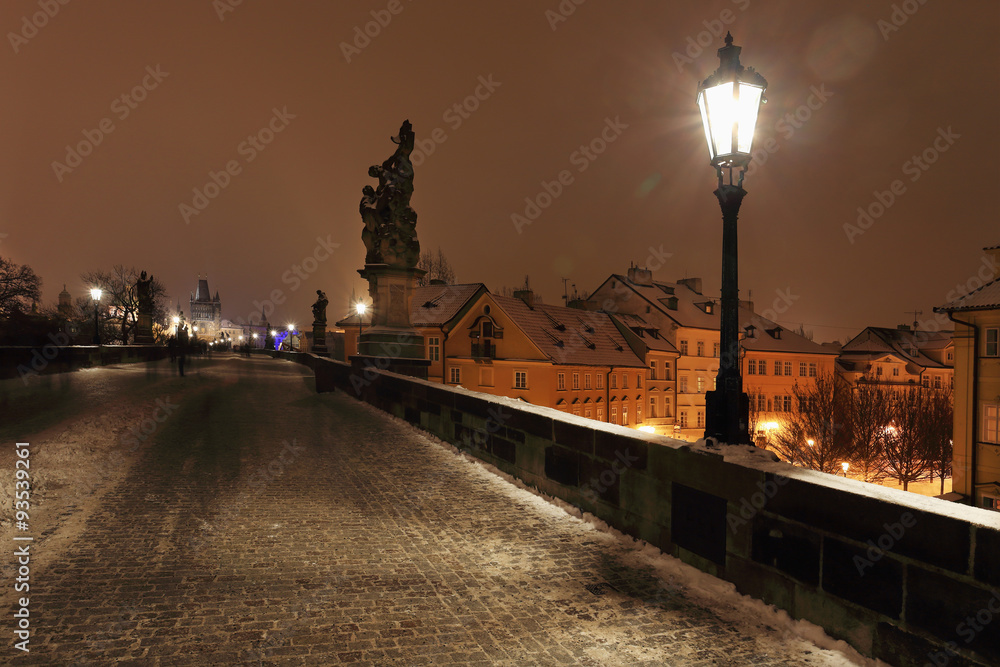 Night snowy Prague Charles Bridge