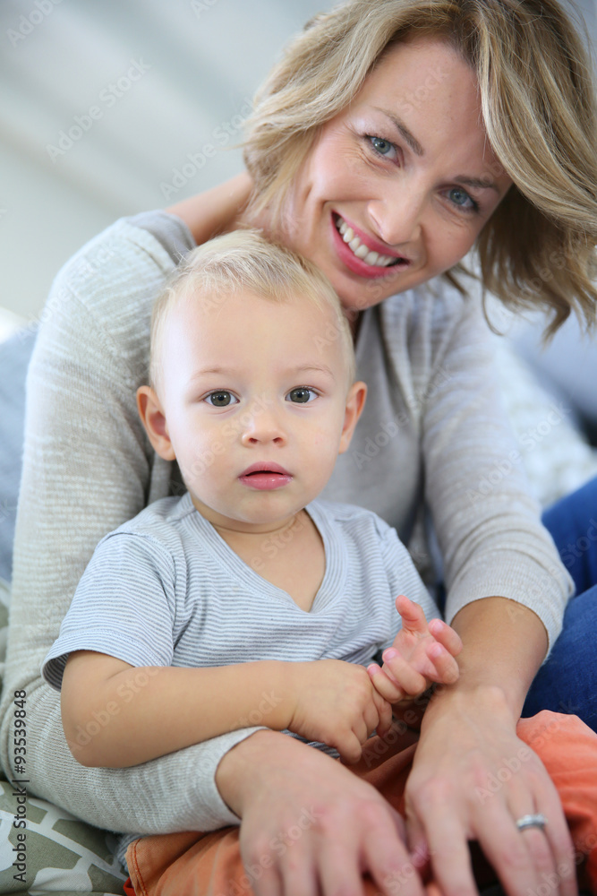 Baby boy sitting on mommy's lap