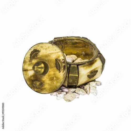 Frankincense granules and old bronze box isolated on a white background