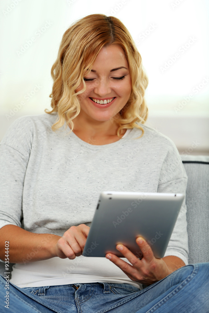 Beautiful woman with fresh fruits and digital tablet on home interior background Beautiful woman with fresh fruits and digital tablet on home interior background