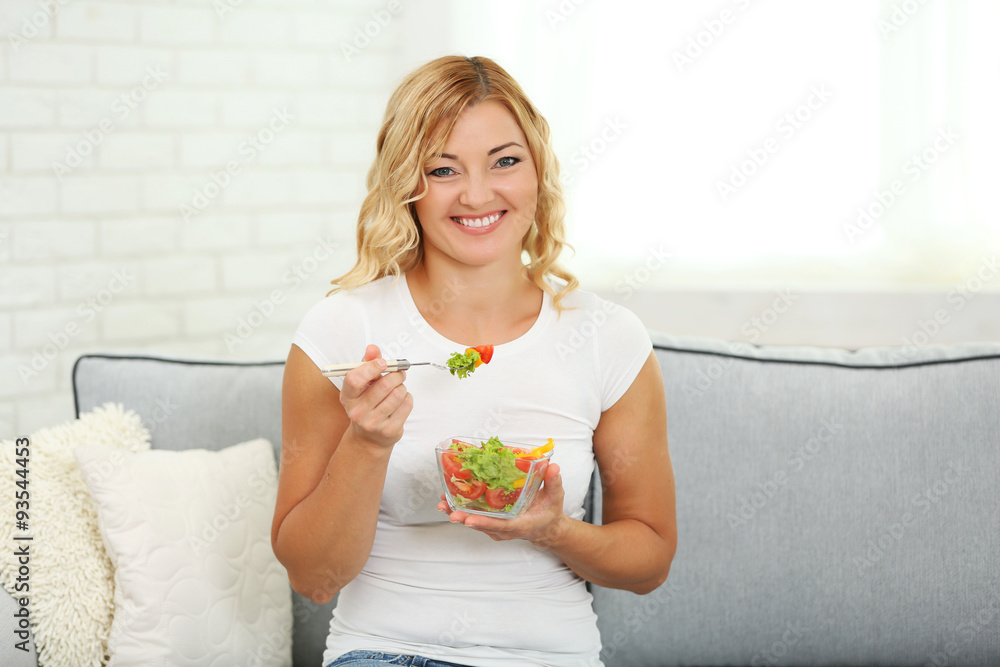 Beautiful woman with salad on home interior background Beautiful woman with salad on home interior background