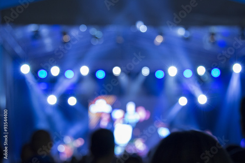 Defocused stage lights and crowd on a concert 