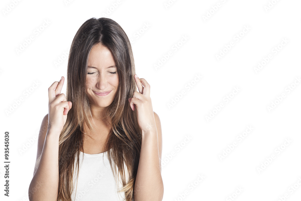 Close-up portrait of a beautiful woman closing her eyes, crossing her fingers hoping for the best, isolated on white background Close-up portrait of a beautiful woman closing her eyes, crossing her fingers hoping for the best, isolated on white background
