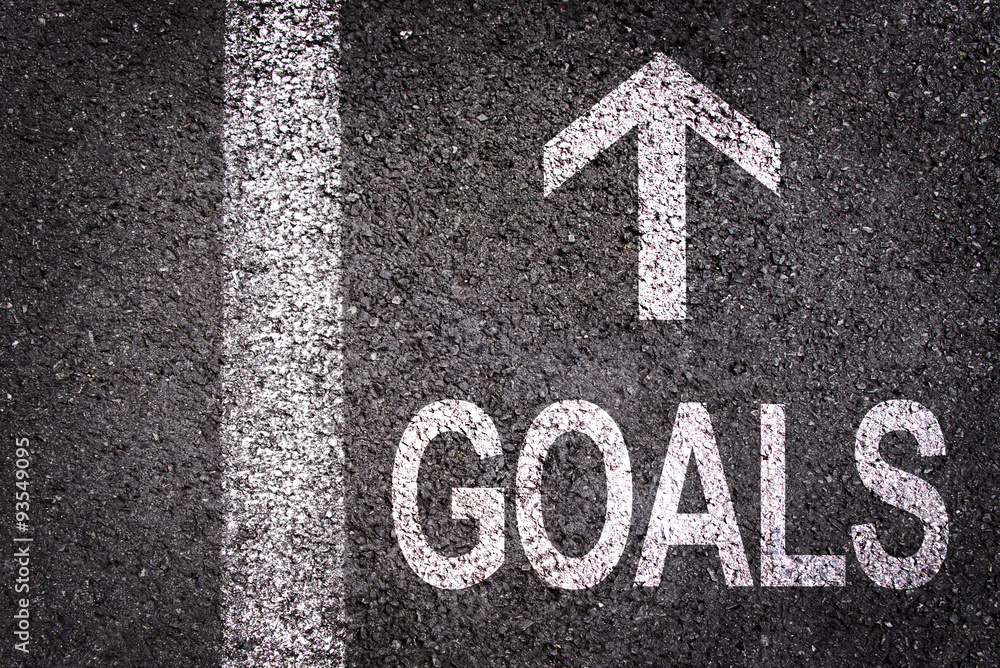 Word Goals and an arrow written on an asphalt road background