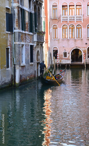 Gondolier in Venice canal, Italy