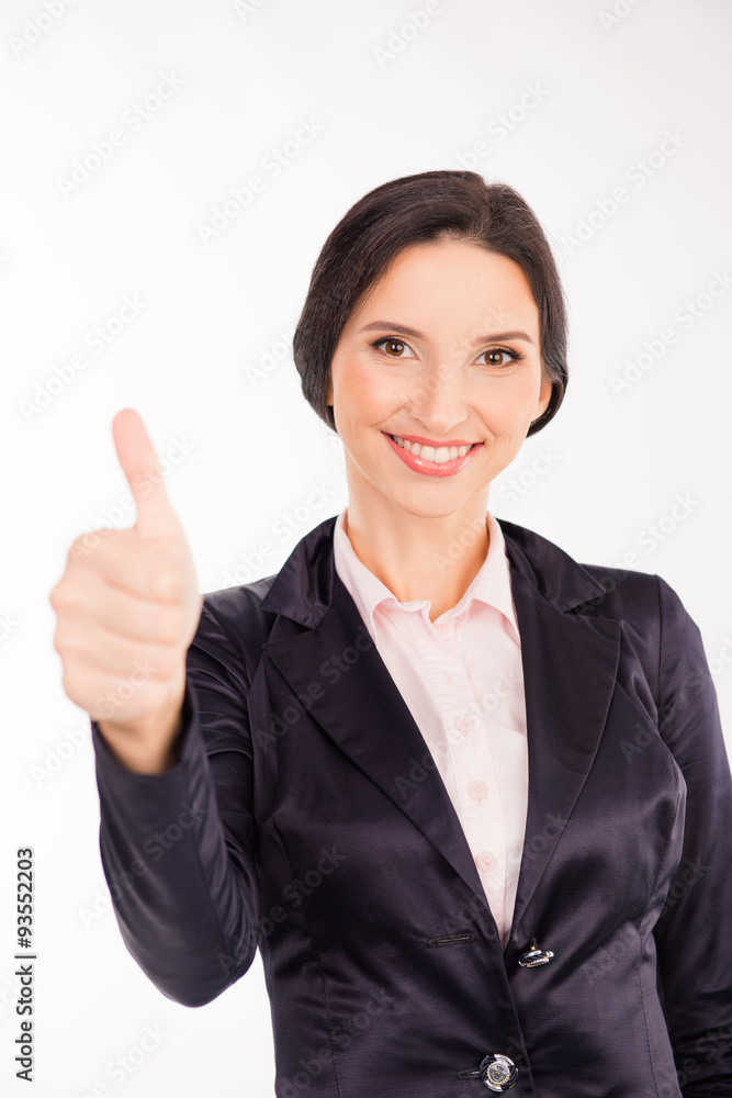 beautiful businesswoman showing thumbs up and smiling beautiful businesswoman showing thumbs up and smiling