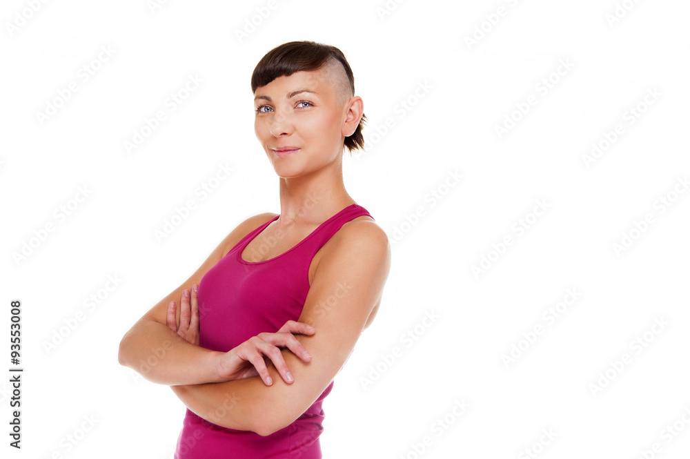 Young woman in fitness outfit with crossed arms over white backg Young woman in fitness outfit with crossed arms over white backg