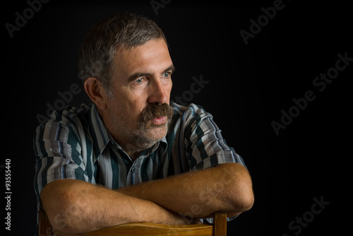 Obraz na plátně Portrait of mature Ukrainian peasant in low key