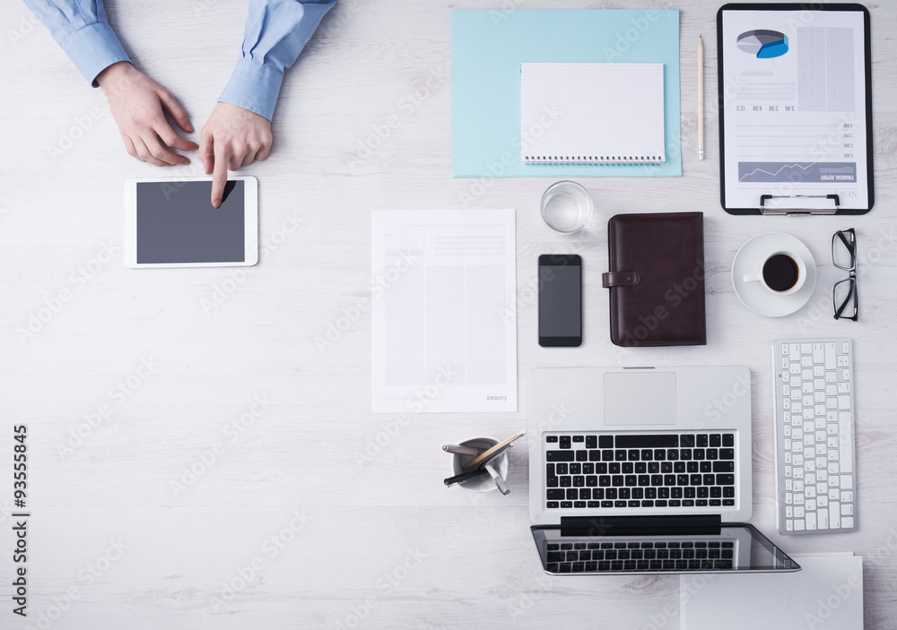 Businessman working at desk with a digital tablet Businessman working at desk with a digital tablet