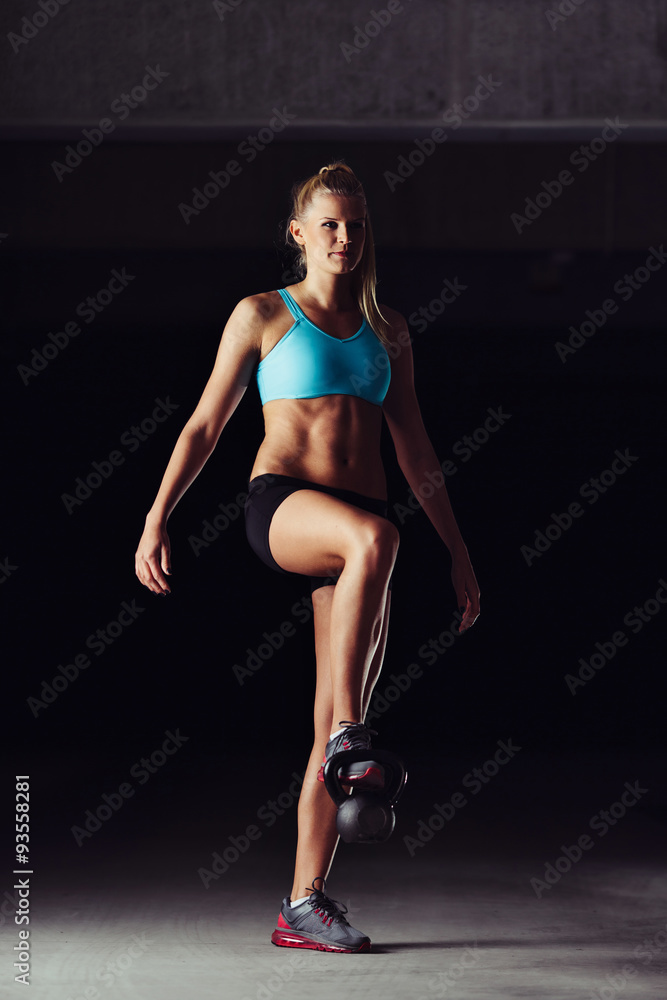 Fit bodybuilder exercising her legs Fit bodybuilder exercising her legs