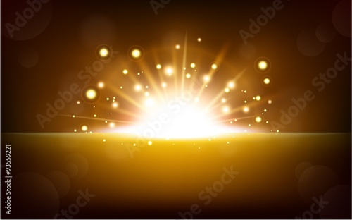 Bright yellow light rising from the black horizon