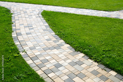 paved path / paved path and green meadow
