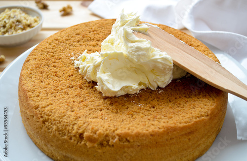 Homemade cake with butter cream and walnuts