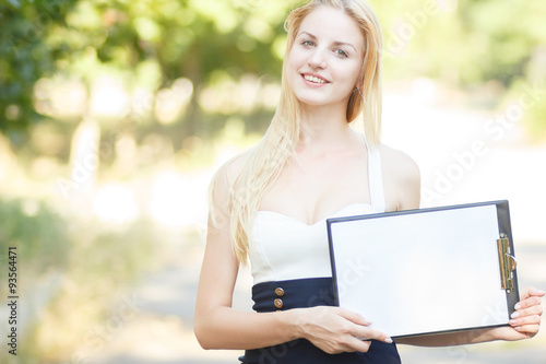 Free Download Portrait of pretty student or businesswoman in smart casual using tablet outdoors  - GFXLoad
