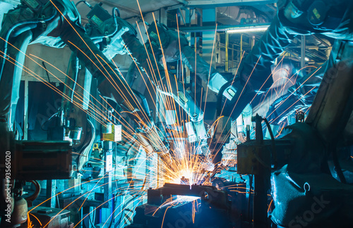Team welding Robot movement Industrial automotive part in factory