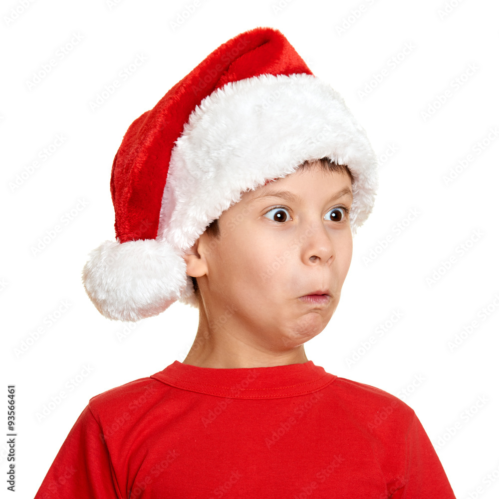 winter holiday christmas concept - boy in santa hat portrait on white isolated winter holiday christmas concept - boy in santa hat portrait on white isolated