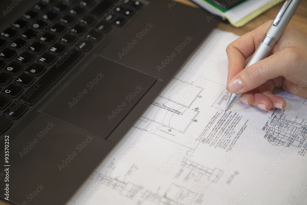 Engineer writing blueprints in the office. Engineer writing blueprints in the office.