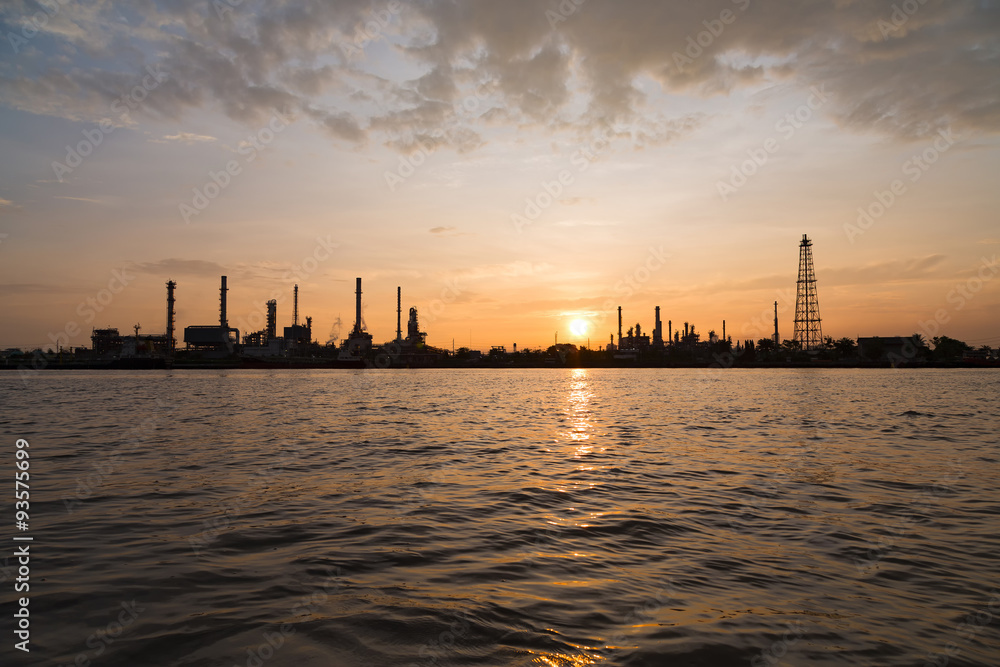Oil refinery factory over sunrise with silhouette in Bangkok, Th