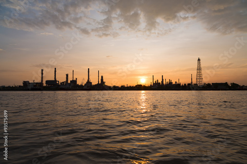 Oil refinery factory over sunrise with silhouette in Bangkok, Th