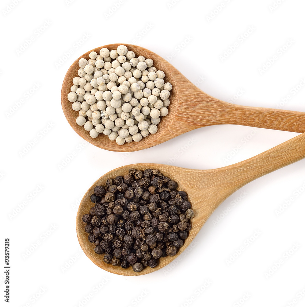 Wooden spoon and peppercorn on white background Wooden spoon and peppercorn on white background