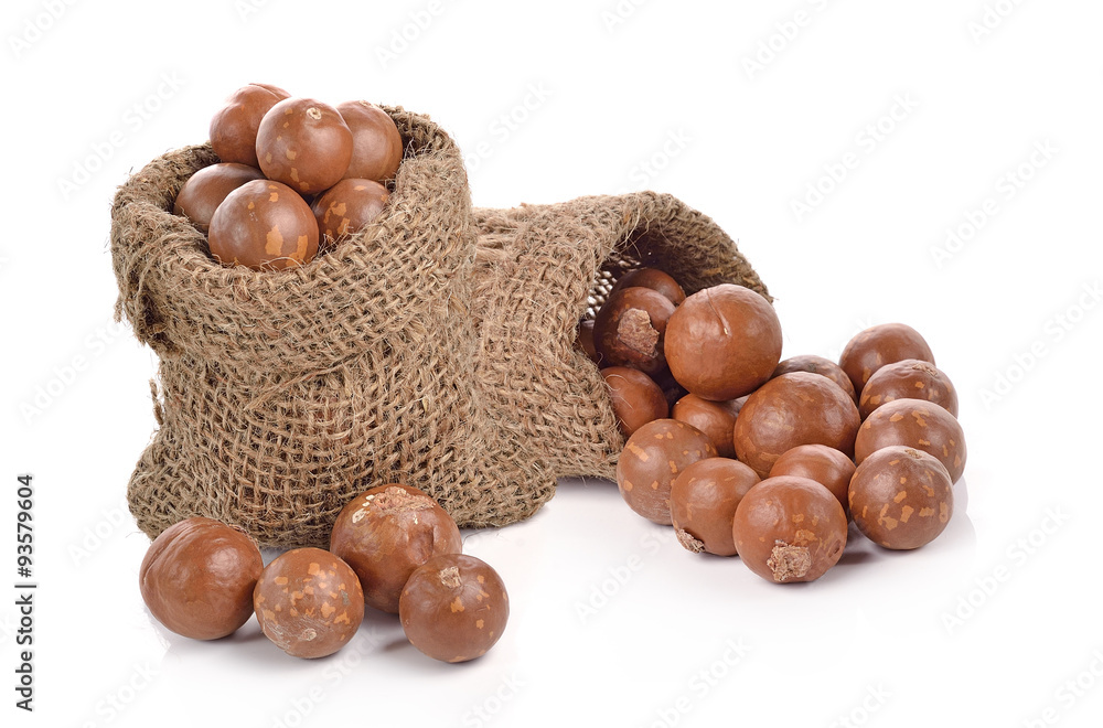 Macadamia nuts in the bag on white background Macadamia nuts in the bag on white background