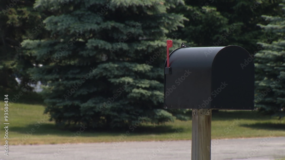 Mailbox with Heavy Traffic. Focus on a black mailbox with red flag up. Traffic is very heavy in the background. cars and trucks fly by. Trees in Background
Mailbox with Heavy Traffic. Focus on a black mailbox with red flag up. Traffic is very heavy in the background. cars and trucks fly by. Trees in Background