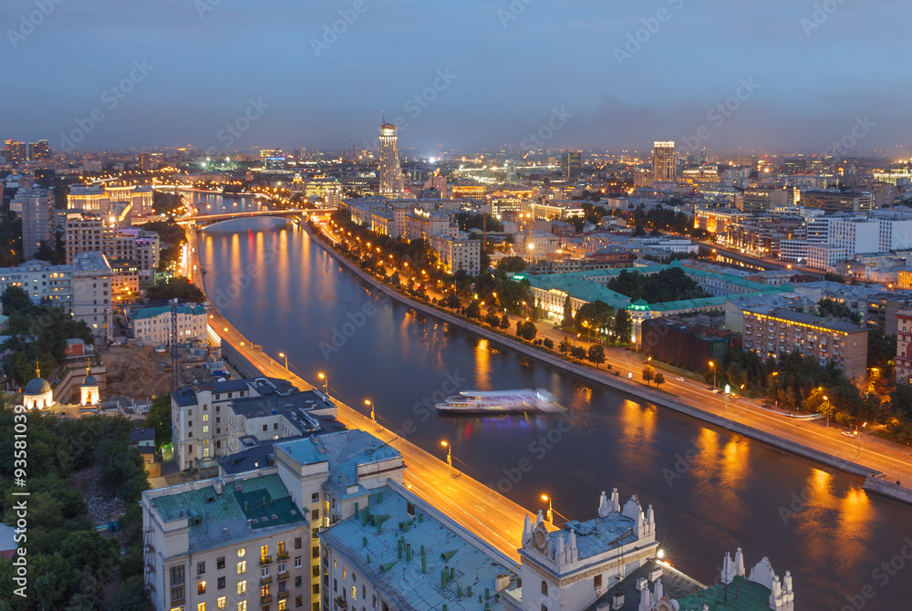 Naklejka premium The evening city of Moscow from a tall building on the embankment of the river