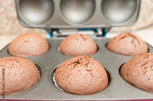 Delicious fresh chocolate cupcakes straight out of oven still