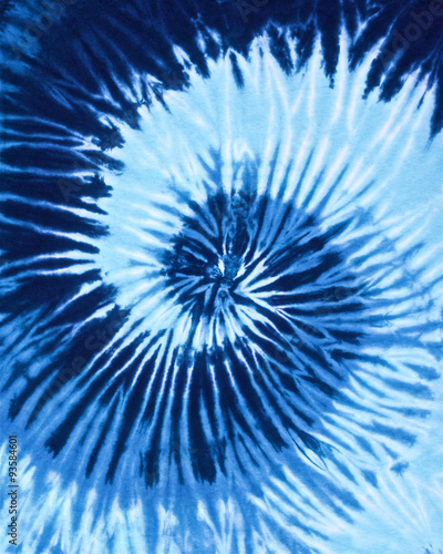 close up shot of spiral blue tone color tie dye fabric texture background