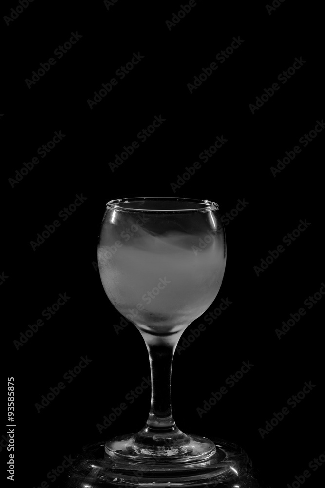 Smoke shisha in cocktail glass on a black background. Smoke shisha in cocktail glass on a black background.